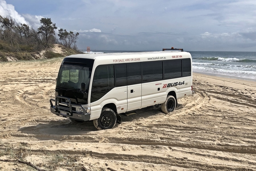 Toyota-Coaster-Beach-Master-10 Toyota Coast on the beach | Featured image of the HiAce Accessories page for Bus 4x4 Group.
